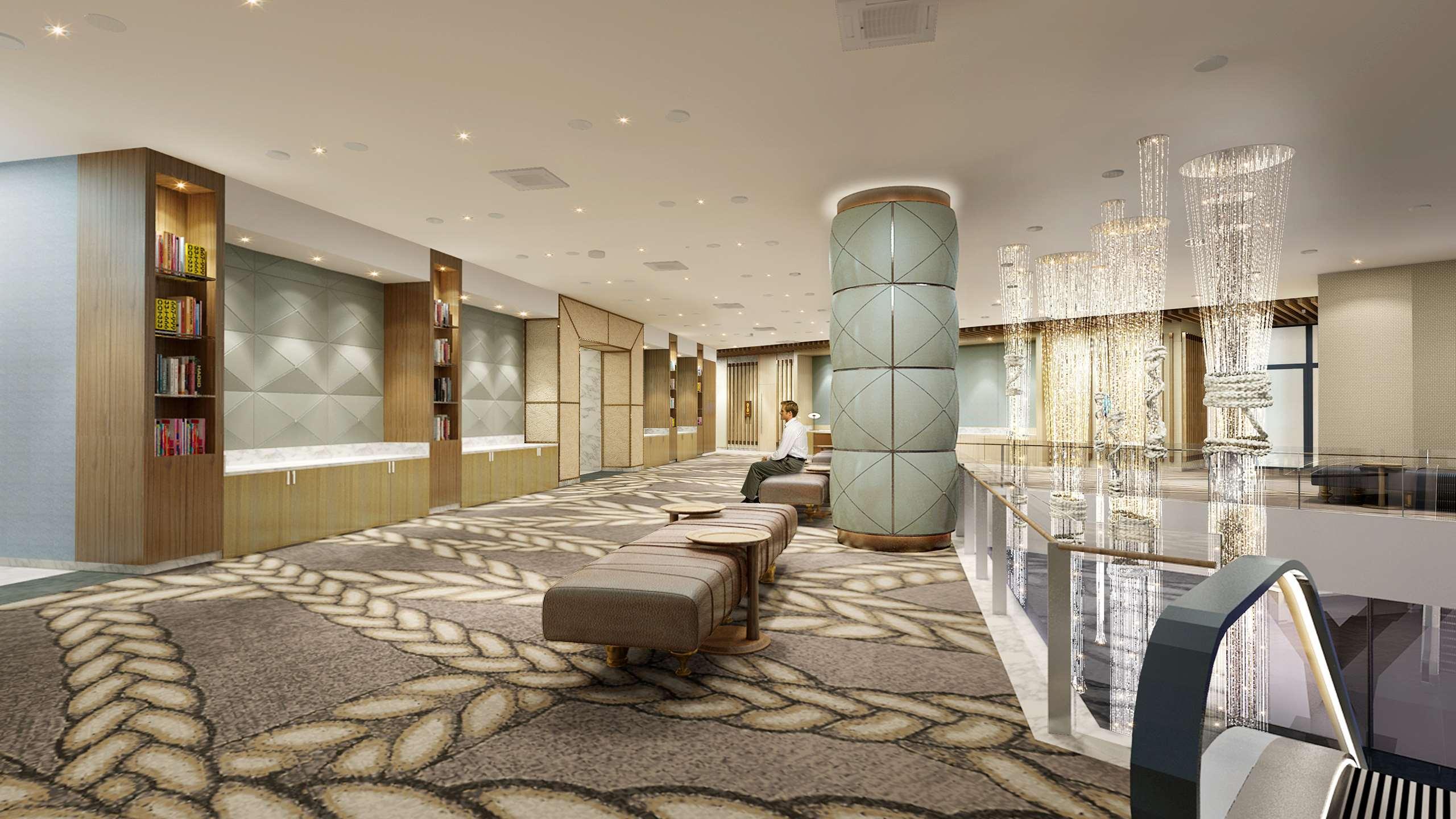 Sofitel Sydney Darling Harbour Hotel Exterior photo The photo depicts a modern, elegantly designed interior space, likely a lobby or reception area. The flooring features intricate, patterned designs that resemble intertwining ropes. There are several comfortable seating options, including long benche